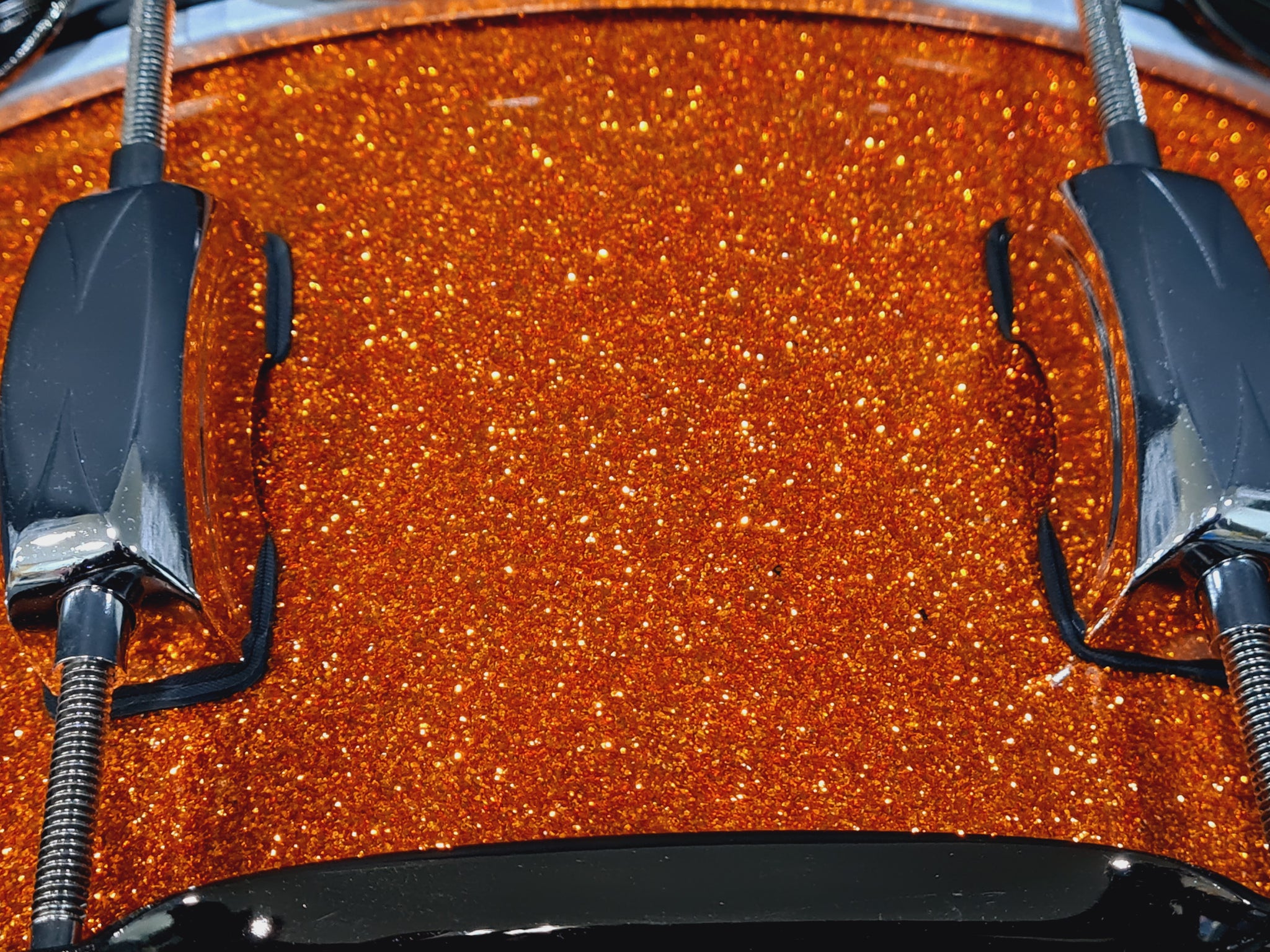 14x5.5" Liberty Drums Snare drum in a stunning orange sparkle lacquer